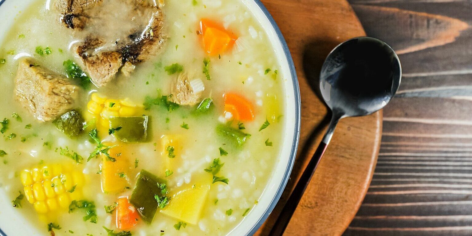 a bowl of soup with a spoon